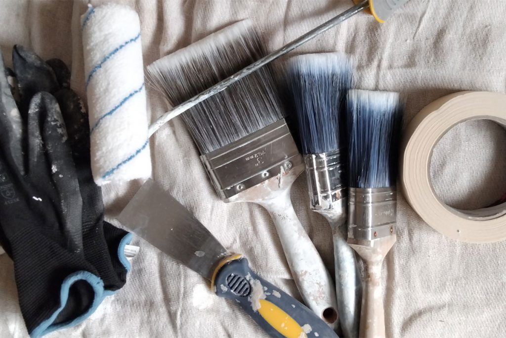 Collection of paint brushes and other painting equipment